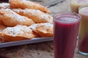Cómo preparar un delicioso api con empanadas y buñuelos